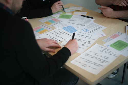 Attendees writing down ideas of how to save water